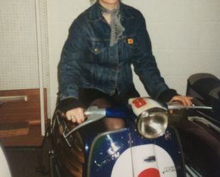 Loretta ( my better half) smiling even though it was her scooter and i sold it to Wellers record company