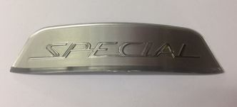 Lambretta silver "Special" shaped rear frame badge  image #1